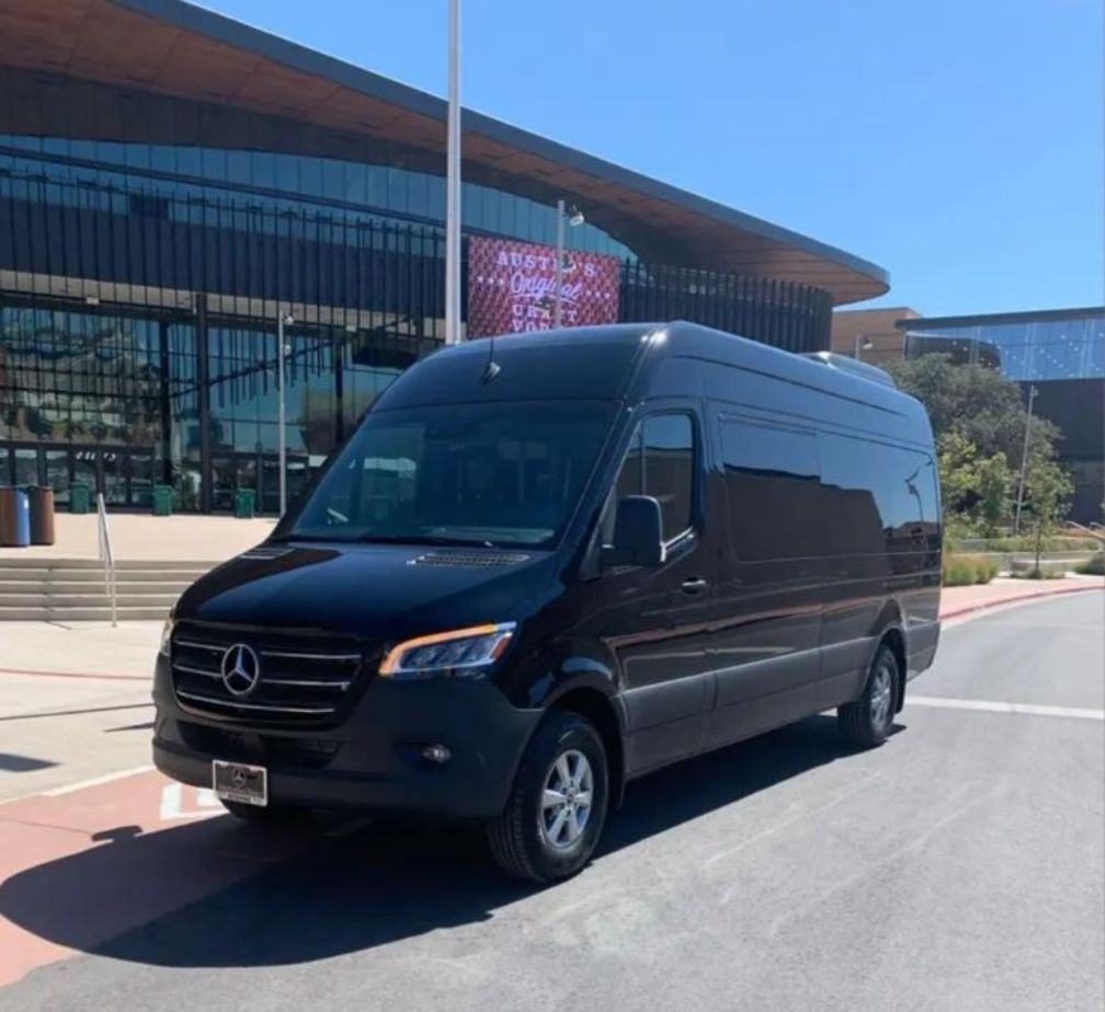 An Ubiquitous Driver Sprinter van outside Moody Center in Austin